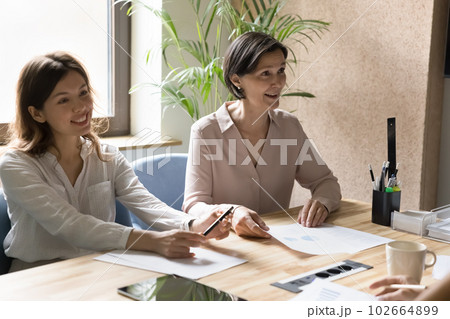 Office employees take part in group meeting in conference room 102664899