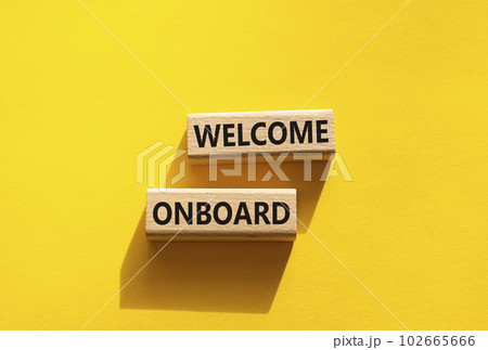 Welcome onboard symbol. Concept words Welcome onboard on wooden blocks. Beautiful yellow background. Business and Welcome onboard concept. Copy space. Welcome onboard symbol. Concept words Welcome onboard on wooden blocks. Beautiful yellow background. Business and Welcome onboard concept. Copy space. 102665666