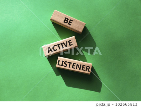 Be active listener symbol. Concept word Be active listener on wooden blocks. Beautiful green background. Business and Be active listener concept. Copy space 102665813