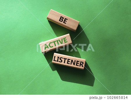 Be active listener symbol. Concept word Be active listener on wooden blocks. Beautiful green background. Business and Be active listener concept. Copy space 102665814