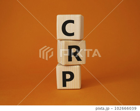 CRP - C-Reactive Protein Test symbol. Wooden cubes with word CRP. Beautiful orange background. Medical and C-Reactive Protein Test concept. Copy space. 102666039