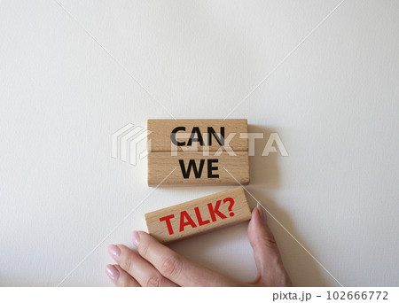 Can we talk symbol. Concept word Can we talk on wooden blocks. Businessman hand. Beautiful white background. Business and Can we talk concept. Copy space 102666772