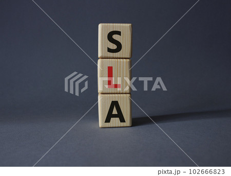 SLA - Service Level Agreement. Wooden cubes with word SLA. Beautiful grey background. Business and Service Level Agreement concept. Copy space. SLA - Service Level Agreement. Wooden cubes with word SLA. Beautiful grey background. Business and Service Level Agreement concept. Copy space. 102666823