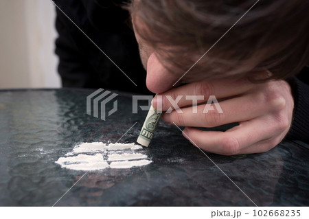 Addict takes a dose of drugs, close up. Addiction concept 102668235