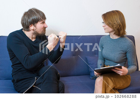 A man in a stressful condition at a consultation with a psychotherapist. Mental health A man in a stressful condition at a consultation with a psychotherapist. Mental health 102668288
