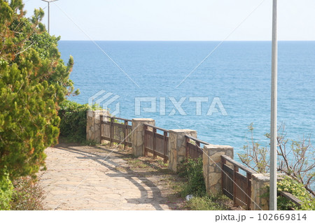 The fence of the picnic area against the background of the sea, Alanya Turkiye, May 2023. 102669814