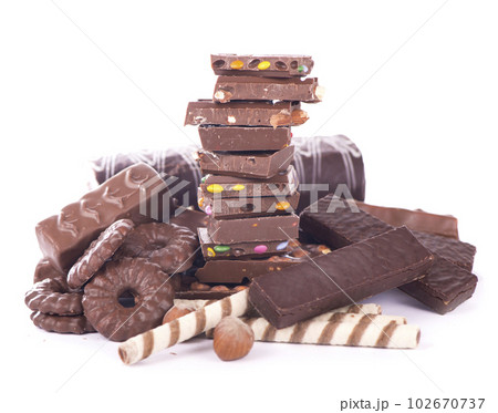 Sweets with nuts and chocolate. gingerbread cookies and chocolate isolated on white background 102670737