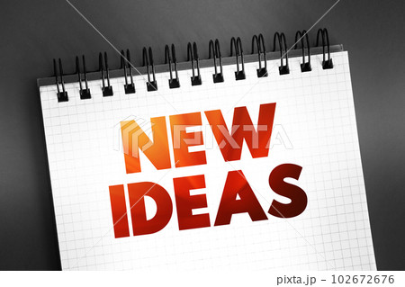 New Ideas text quote on notepad, concept background New Ideas text quote on notepad, concept background 102672676