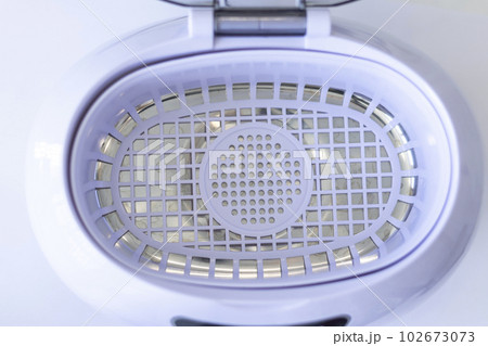 Ultrasonic washing inside, top view on white background Ultrasonic washing inside, top view on white background 102673073