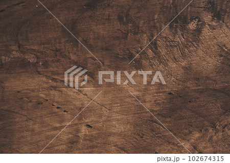 Old grunge background made of dark textured wood, surface made of old brown wood texture. A template for your design with space to copy. High quality photo 102674315