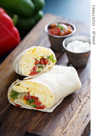 Vegetarian breakfast burrito with eggs 102674661