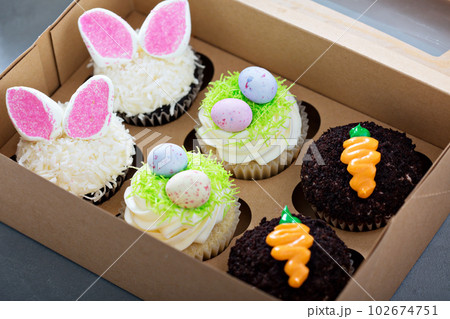 Assortment of easter cupcakes in a box 102674751