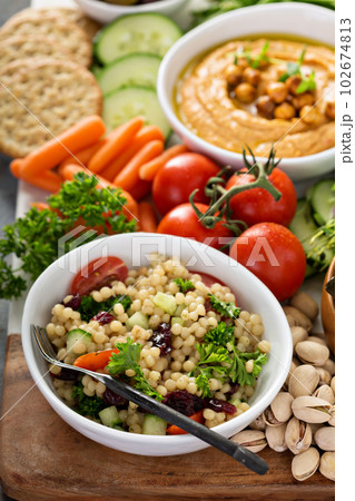 Pearl couscous salad with fresh vegetables Pearl couscous salad with fresh vegetables 102674813