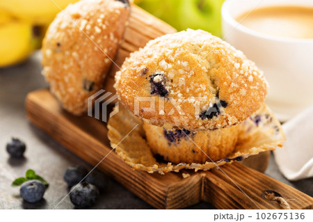 Blueberry and banana muffins with coffee for breakfast Blueberry and banana muffins with coffee for breakfast 102675136