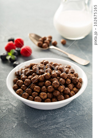 Chocolate cereals in a white bowl Chocolate cereals in a white bowl 102675165