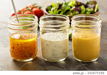Variety of sauces and salad dressings 102675399