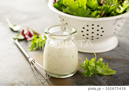 Homemade ranch dressing in a small jar Homemade ranch dressing in a small jar 102675438