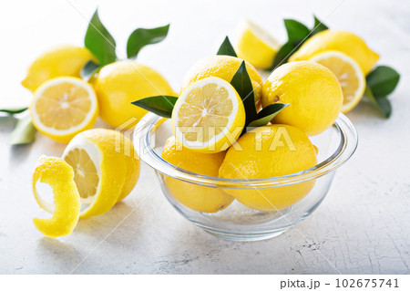 Fresh lemons in a glass bowl Fresh lemons in a glass bowl 102675741