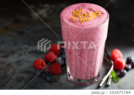 Berry smoothie in a tall glass 102675799