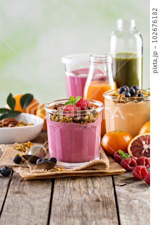 Healthy orange and raspberry smoothie 102676182