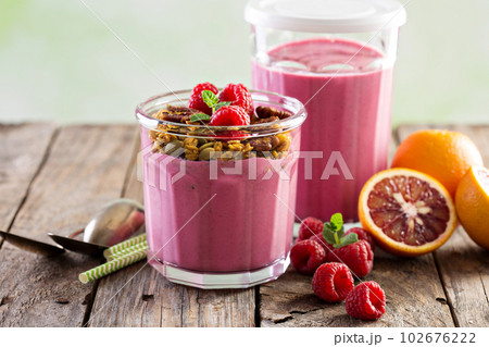 Healthy orange and raspberry smoothie Healthy orange and raspberry smoothie 102676222