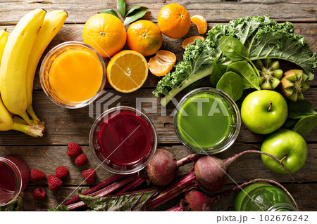 Variety of fresh vegetable and fruit juices 102676242