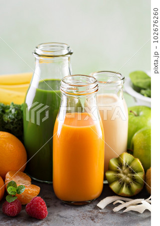 Variety of fresh vegetable and fruit juices 102676260