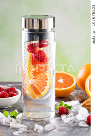 Infused detox water with raspberry Infused detox water with raspberry 102676303