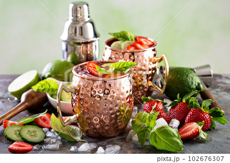Moscow mule cocktail with lime and strawberry 102676307