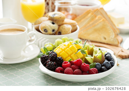 Fresh and bright continental breakfast table Fresh and bright continental breakfast table 102676428