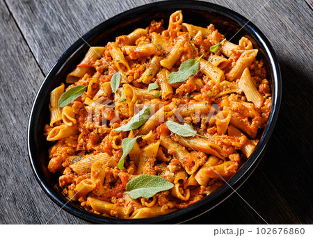 Whole wheat pasta bake with ground beef and cheese 102676860