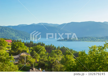 landscape of Lake Bicaz surrounded by mountains in Romania landscape of Lake Bicaz surrounded by mountains in Romania 102679245