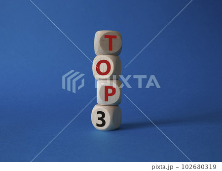 Top 3 symbol. Concept word Top 3 on wooden cubes. Beautiful blue background. Business and Top 3 concept. Copy space. Top 3 symbol. Concept word Top 3 on wooden cubes. Beautiful blue background. Business and Top 3 concept. Copy space. 102680319