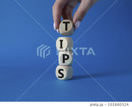Stop symbol. Concept word Stop on wooden cubes. Businessman hand. Beautiful blue background. Business and Stop concept. Copy space. Stop symbol. Concept word Stop on wooden cubes. Businessman hand. Beautiful blue background. Business and Stop concept. Copy space. 102680324