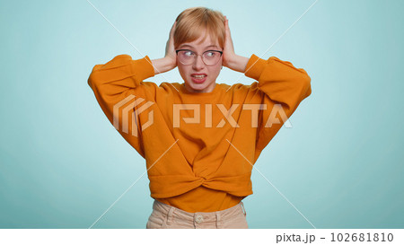 Annoyed irritated young woman covering ears gesturing No avoiding advice ignoring noise loud voices Annoyed irritated young woman covering ears gesturing No avoiding advice ignoring noise loud voices 102681810