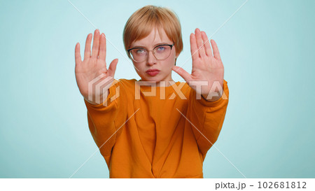 Woman say No hold palm folded crossed hands in stop gesture warning of finish prohibited access Woman say No hold palm folded crossed hands in stop gesture warning of finish prohibited access 102681812