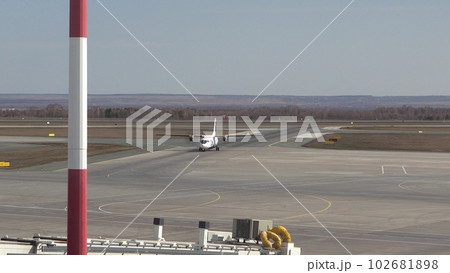 The plane has landed on the runway and is moving along the runway. International Airport. The plane has landed on the runway and is moving along the runway. International Airport. 102681898