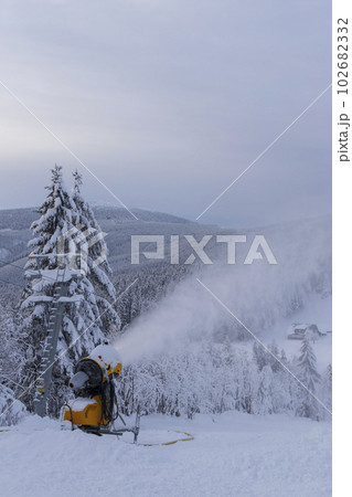 Snow cannon in winter landscape Snow cannon in winter landscape 102682332