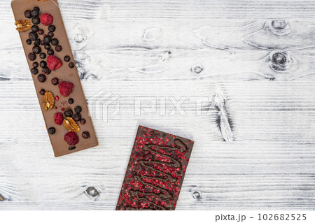 still life of chocolate with different kind dried fruit still life of chocolate with different kind dried fruit 102682525