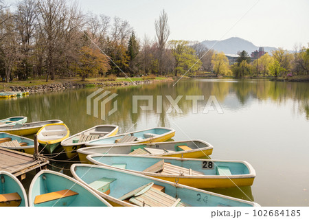 Nakajima park pond and boat in Sapporo, Hokkaido, Japan 102684185