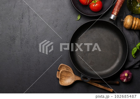 Top-down view of a kitchen table with ingredients, utensils, and copy space 102685487