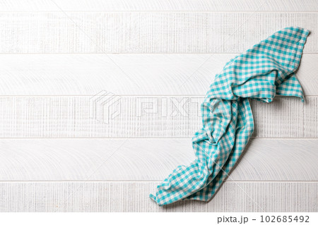 Top-down view of a kitchen table with a towel or napkin Top-down view of a kitchen table with a towel or napkin 102685492