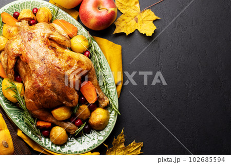 Thanksgiving turkey on rustic table Thanksgiving turkey on rustic table 102685594