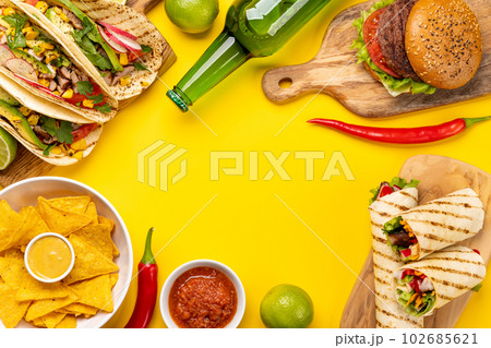 Mexican food featuring tacos, burritos, nachos, burgers 102685621