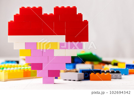Heart shaped toy constructor details on white background Heart shaped toy constructor details on white background 102694342