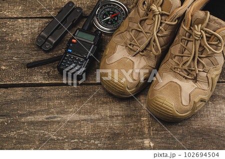 Equipment set for traveler including hiking boots and walki-talkie Equipment set for traveler including hiking boots and walki-talkie 102694504