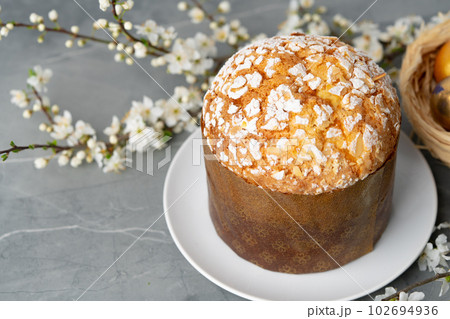Easter cake with sugar powder on gray background Easter cake with sugar powder on gray background 102694936