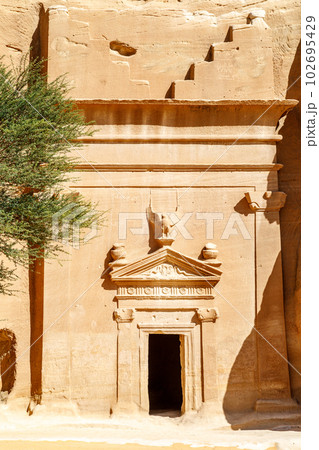 Carved ornamented entrance to the tomb at Jabal al banat complex, Hegra, Al Ula, Saudi Arabia Carved ornamented entrance to the tomb at Jabal al banat complex, Hegra, Al Ula, Saudi Arabia 102695429