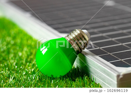 Solar energy panel and light bulb, green energy 102696119