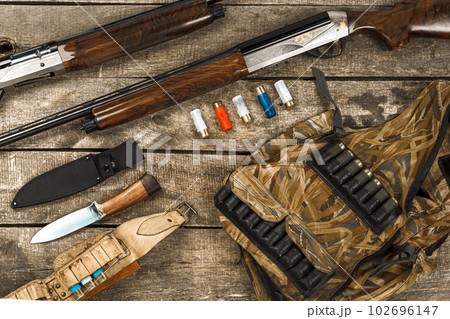 Hunting equipment on old dark wooden background 102696147